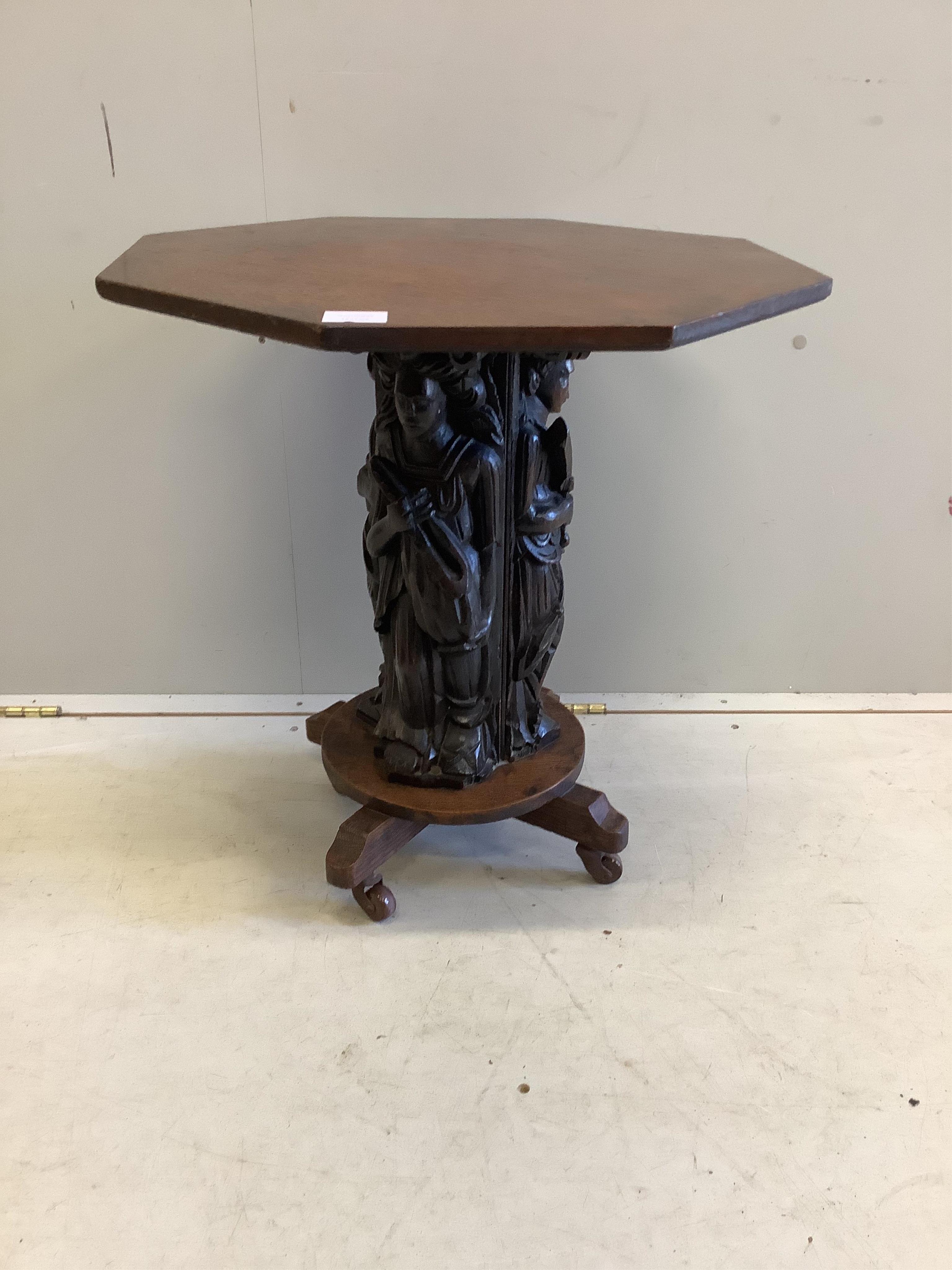 A 19th century octagonal oak side table with figural column, incorporates old timber, width 55cm, depth 55cm, height 59cm